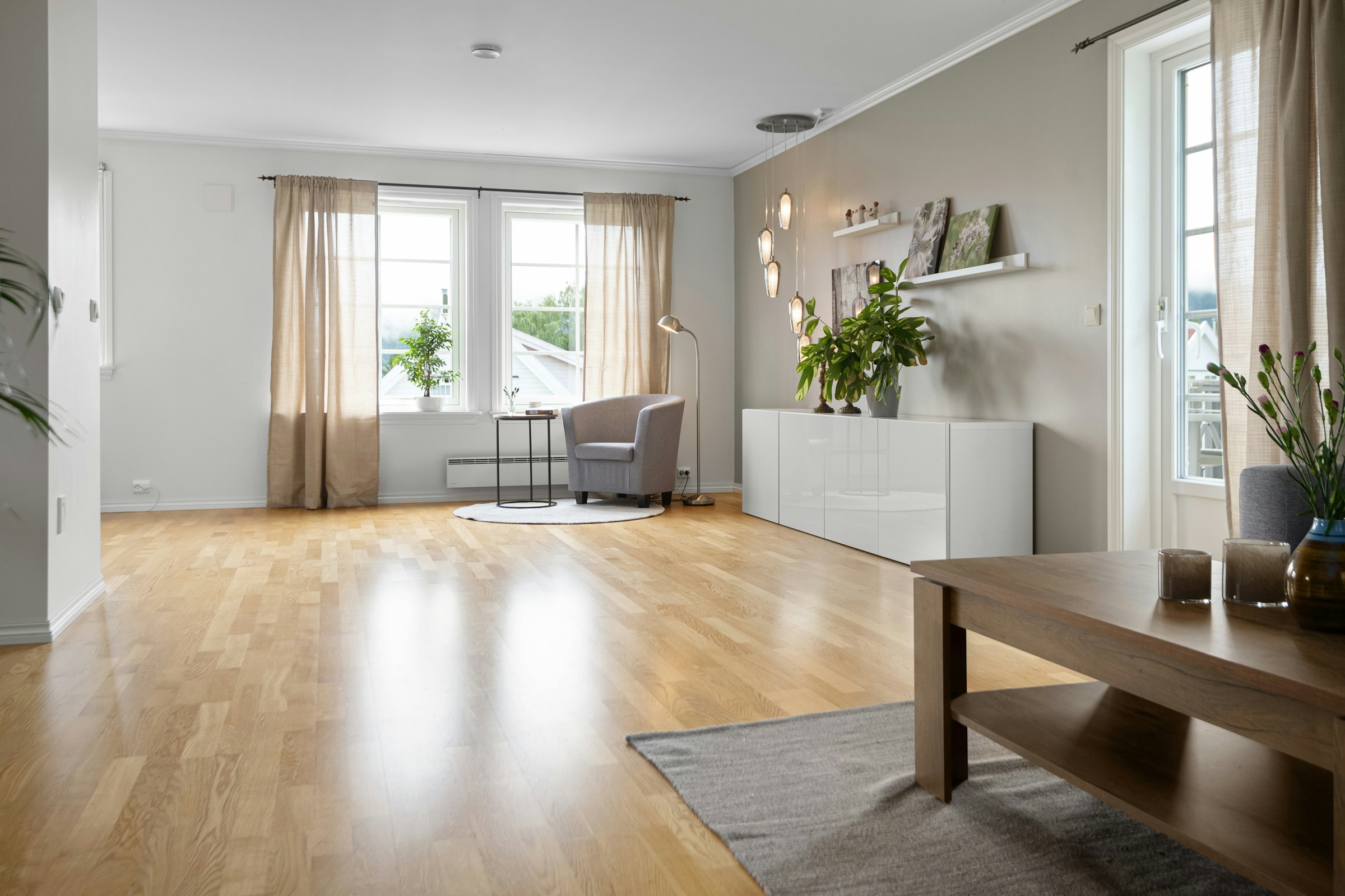 Warm wooden flooring in a contemporary living room