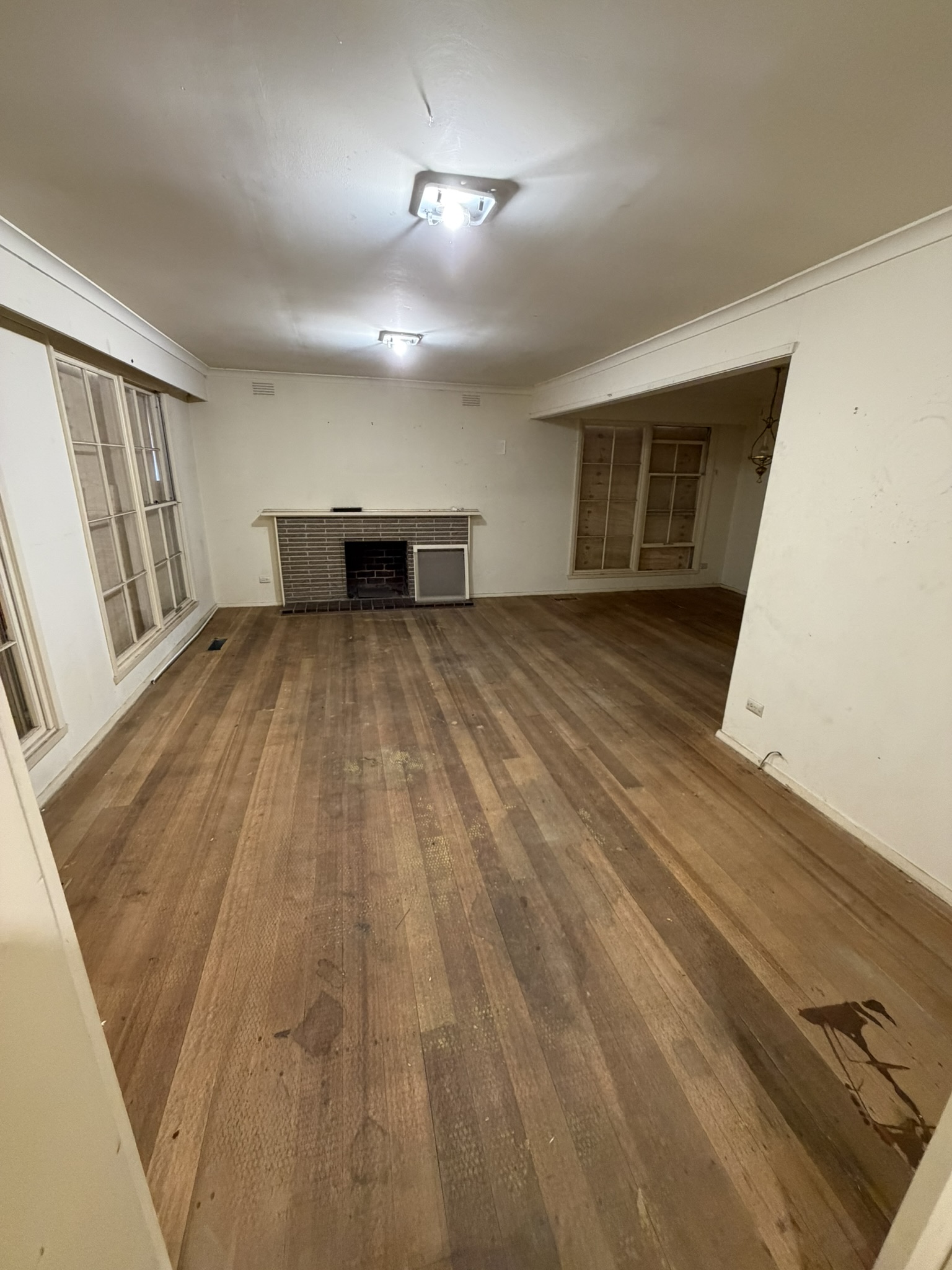 Living room floor restoration before sanding